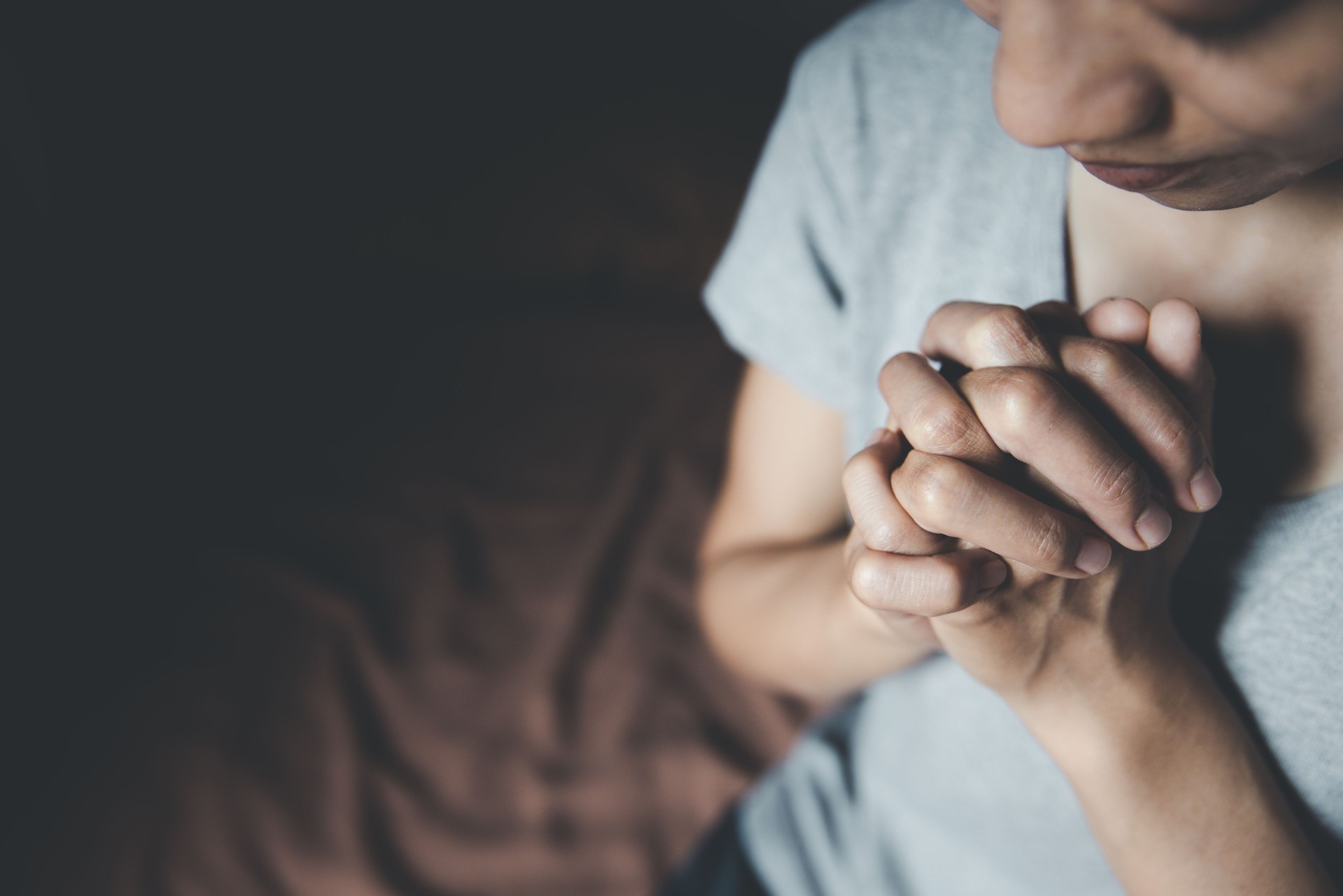 Female hands praying for God's blessing to wish for a better life. Believe in goodness, shake hands in prayer. Love, mercy, help from God. Praise the religion. Supreme Faith in the God of Success.