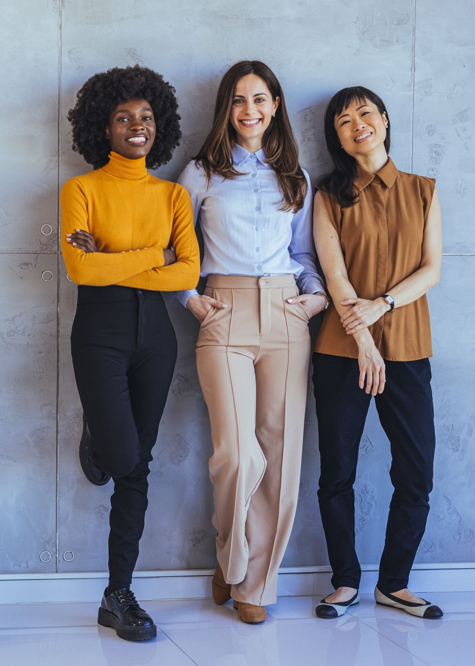 Confident Women Standing Together in Modern Office Setting